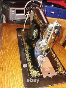 Vintage Singer Treadle sewing machine in cabinet