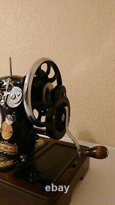 Vintage Singer hand crank sewing machine with coffin carrier lock and key