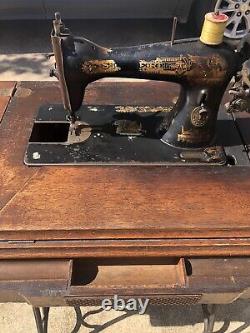 Vintage Sphinx singer sewing machine in cabinet 1901