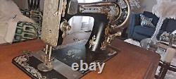 Vintage singer treadle sewing machine in cabinet