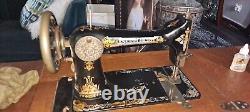 Vintage singer treadle sewing machine in cabinet