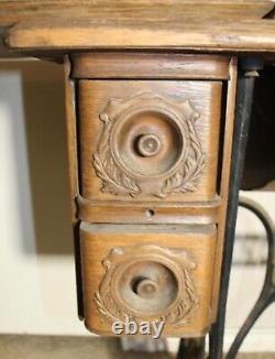 Vintage singer treadle sewing machine in cabinet