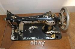 Vintage singer treadle sewing machine in cabinet