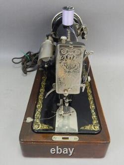 Belle machine à coudre électrique Singer de 1927, modèle 99, avec boîtier en bois courbé, antique