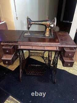 Rare antique machine à coudre Singer en bois de bureau vintage des années 1900.